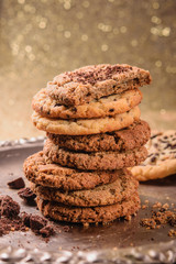 Healthy homemade, oatmeal cookies on a golden background. Baking for Christmas and New Year