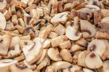 Mushrooms are fried in a pan