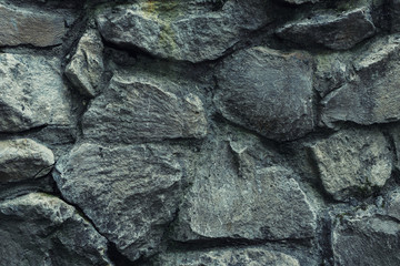 Stones background, large stones, boulders in masonry, part of the stone fence
