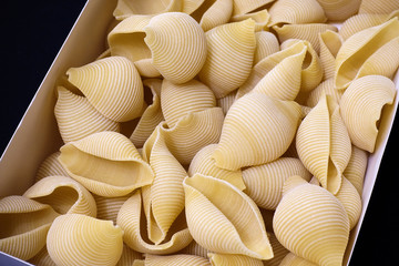 Pasta in the form of shells close-up. Culinary Background