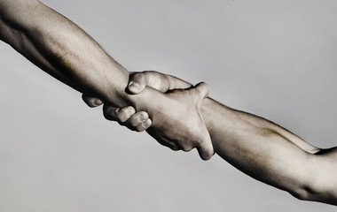 Rescue, helping gesture or hands. Strong hold. Two hands, helping hand of a friend. Handshake,...