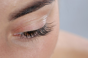 Fototapeta premium Young woman with beautiful eyelashes, closeup view