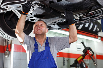 Mechanic engaged in car repair
