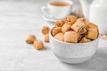 Tasty sweet cookies with poppy seeds on gray table. Space for text