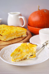 Pumpkin-lemon cheesecake in a white porcelain plate