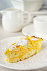 Pumpkin-lemon cheesecake in a white porcelain plate