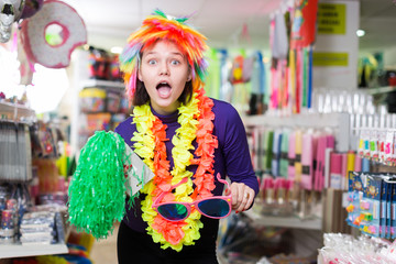 Female having fun in festival outfits store