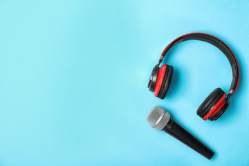 Microphone, headphones and space for text on color background, flat lay