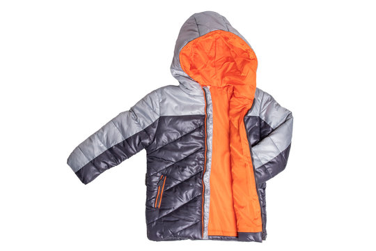 Winter jacket isolated. A stylish black warm down jacket with orange lining for the kids isolated on a white background. Childrens wear for winter.