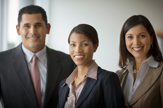 Portrait of three smiling business colleagues.