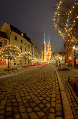 Fototapeta na wymiar Night view of Ostrow Tumski in the Christmas version.Wroclaw,Poland.