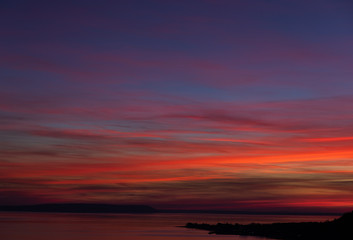 Fototapeta na wymiar Beautiful and colorful sunset on river Volga