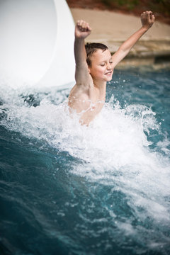 Boy coming down waterslide