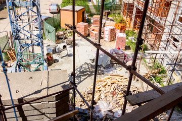 Above view on construction site area, piled resources for building edifice
