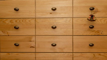 Christmas bells hanging on the drawer handle.