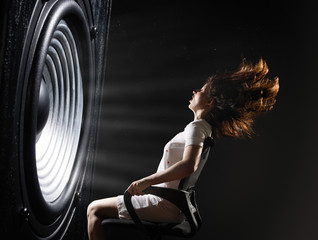 The sound wave set back an office chair with young woman.