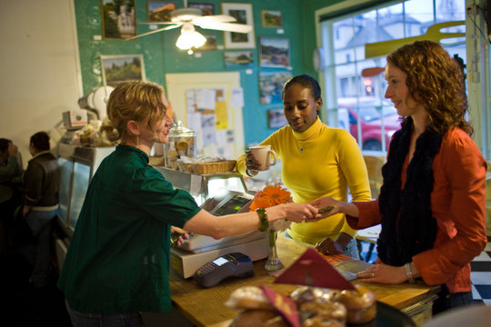 Women ordering food in cafe