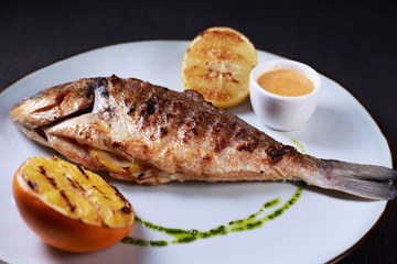grill pub and fish restaurant menu, proper nutrition, seafood, vegetarian, pescetarian. grilled dorado fish with citrus and sauce
