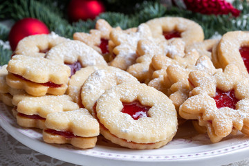 Linzer Christmas cookies arranged on a plate