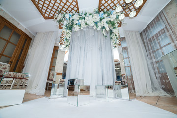 Place for wedding ceremony in white color ,with white fireplace