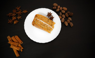 Close-up of a carrot cake on black background