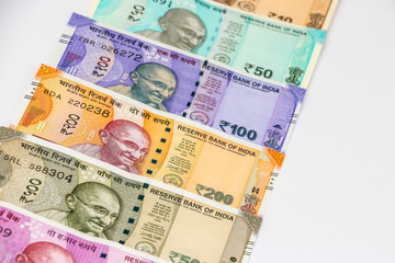 Close up view of brand new indian 10, 50, 100, 200, 500 and 2000 rupees banknotes. Colorful money background.