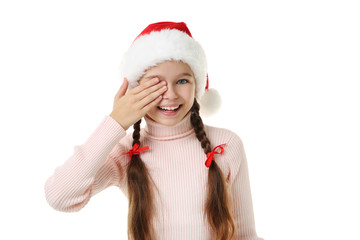 Young girl in santa hat on white background