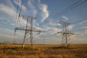 electricity pylons at sunset