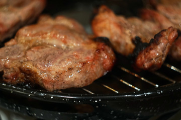 Marinated  grilled Steak On The Hot BBQ Charcoal Grill.