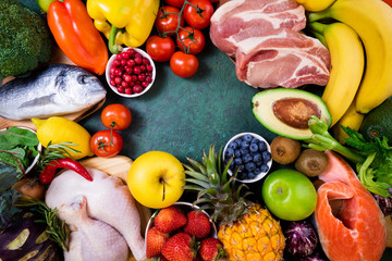 Background healthy food. Fresh fruits, vegetables, meat and fish on table. Healthy food, diet and...