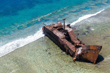 Aerial view of the shipwreck site of 1965 of Motor vessel "Ever Prosperity" cargo ship from Monrovia, Liberia. West Coast barrier reef, Coral sea, New Caledonia, South Pacific Ocean.