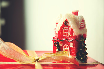 Red gift box and house model