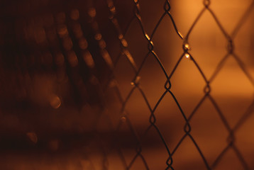 Chain link fence at night