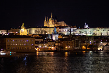 Fototapeta na wymiar Prague, Czech Republic, Europe,Night panorama overlooking the historic buildings of Prague Castle, Charles Bridge and the Vltava River