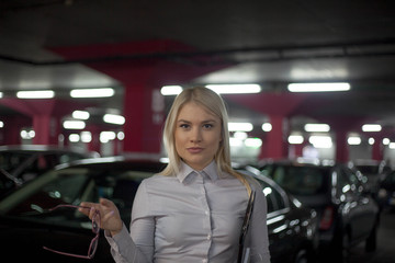 Fototapeta na wymiar Professional gorgeous saleswoman at car dealership in formal wear.