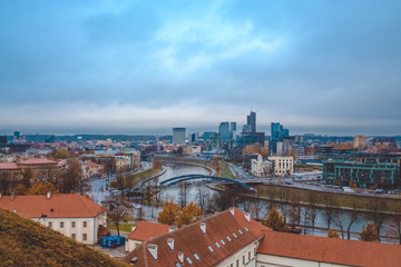 Obraz premium Evening view from remaining part of the Upper Vilna Castle, near Gediminas' Tower, on Skyscrapers of New Center and Neris river, Vilnius (Republic of Lithuania). October 23, 2018.