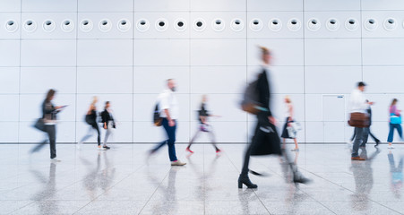 blurred business people at a trade fair