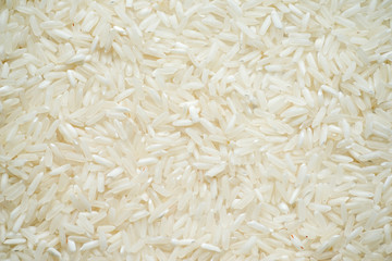 White long rice background, uncooked raw cereals, macro abstract top view background