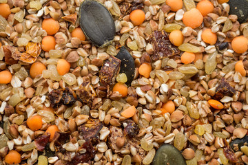 Dry mix of cereal buckwheat, bulgur, lentils and dried tomatoes, top view. Abstract background for your design