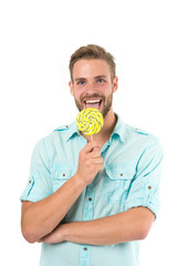 Lick it. Man handsome bearded guy smiling while licking candy. Guy cheerful smile macho feels happy...
