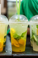 Mojito Cocktail Cooling drink with fruit. Vertical photo.