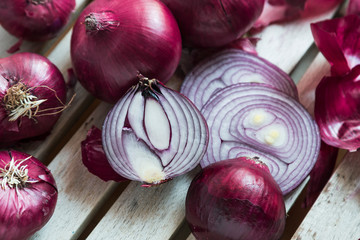 Red Onions on a rustic wooden borad