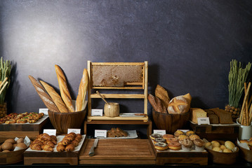 Bread bar station in buffet, close-up. Assortment of fresh pastr