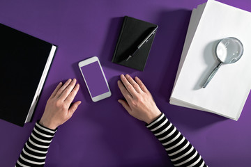 Top view of office desk top with smartphone mock up