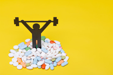 weightlifting pictogram wiht pills