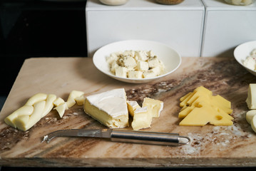 Hotel restaurant table with various types of cheese. Buffet cate