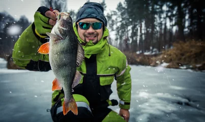 Foto op Canvas Trophy perch. Ice fishing background. © vitaliy_melnik
