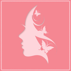Profile of a beautiful woman on a pink background