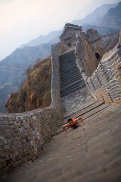 Chinese Olympian at the Great Wall of China.