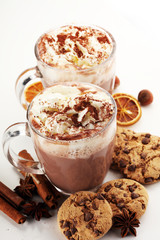Hot chocolate cocoa with whipped cream on table.